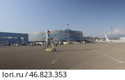 Sochi, Russia - 10 October, 2024: A red-haired beautiful woman rides a Yandex electric scooter in the Olympic Park. Стоковое видео, видеограф Арзюков Вадим Николаевич / Фотобанк Лори