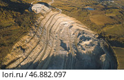 Top view of picturesque quarry located on coastal mountain near village in forest. Стоковое фото, фотограф David Kashakhi / Фотобанк Лори