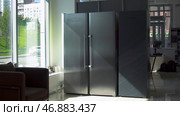 Two large compartments for freezing and storage in double refrigerator. Стоковое фото, фотограф David Kashakhi / Фотобанк Лори