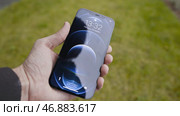 MOSCOW, RUSSIA-NOVEMBER, 2020: Close-up of new iPhone in your hand. Редакционное фото, фотограф David Kashakhi / Фотобанк Лори