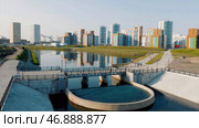 Aerial view of a beautiful city district with colorful high rise buildings on blue sky background. Стоковое фото, фотограф David Kashakhi / Фотобанк Лори