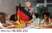 in geography lesson, students carefully listen to woman teacher who talks about Germany. Стоковое видео, видеограф Яков Филимонов / Фотобанк Лори