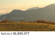 Panoramic view of the scenic autumn valley from a steep bushy slope on sunset sky background. Стоковое фото, фотограф David Kashakhi / Фотобанк Лори