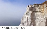 Aerial view of a beautiful white cliff on cloudy blue sky background, travel attraction. Стоковое фото, фотограф David Kashakhi / Фотобанк Лори