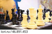 Close up for people playing giant chess, board games concept. Стоковое фото, фотограф David Kashakhi / Фотобанк Лори