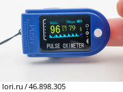 Medical pulse oximeter with an LCD. Assessment of blood oxygen saturation SpO2. COVID-19 Medical monitoring device pandemic. Heart and pulse rate, crucial in patient health monitoring, emergencies. Стоковое фото, фотограф Андрей Ка / Фотобанк Лори