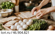 Passover preparation with matzah crackers and handmade matzo balls. Стоковое AI-изображение, AI-художник Анастасия Золотницкая / Фотобанк Лори