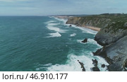 Atlantic coast with rock cliffs and waves. Стоковое видео, видеограф Михаил Коханчиков / Фотобанк Лори