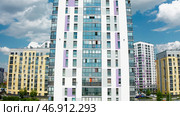 Aerial view of an apartment housing complex and parking space near buildings. Стоковое фото, фотограф David Kashakhi / Фотобанк Лори