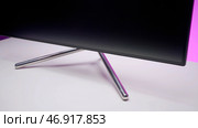 Computer or monitor standing on white table surface. Стоковое фото, фотограф David Kashakhi / Фотобанк Лори