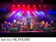 Performance of a symphony orchestra. Women and men play violins (2024 год). Редакционное фото, фотограф Евгений Ткачёв / Фотобанк Лори