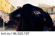 Stylish woman with dreadlocks turns to show them off. Стоковое фото, фотограф David Kashakhi / Фотобанк Лори