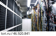Room with data centers, cables and solar panels to absorb bright artificial lighting. Стоковое фото, фотограф David Kashakhi / Фотобанк Лори