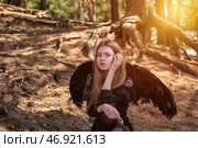 Exploring the Enchanting Forest as a Teen Girl Model Embodies Elegance and Mystery. Стоковое фото, фотограф Aleksandr Golubev / Фотобанк Лори