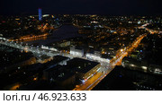 Skyscrapers with illumination in city at night, top view from One building. Редакционное фото, фотограф David Kashakhi / Фотобанк Лори