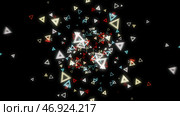 Abstract background of numerous multicolored neon triangles floating on a black. Стоковая иллюстрация, иллюстратор David Kashakhi / Фотобанк Лори
