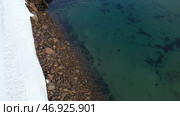 Top view of graveyard of ships in turquoise water off snowy coast in winter. Стоковое фото, фотограф David Kashakhi / Фотобанк Лори