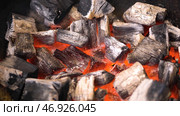TView Of Hot Flaming Charcoal Briquettes Glowing In The BBQ Grill Pit. Стоковое фото, фотограф David Kashakhi / Фотобанк Лори