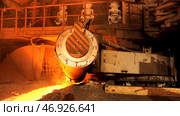 Close up for the steel furnace with temerature indicators at the metallurgical factory shop, heavy metallurgy concept. Стоковое фото, фотограф David Kashakhi / Фотобанк Лори