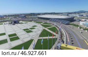 Building site of stadium for racing near town and mountains at summer sunny day. Стоковое фото, фотограф David Kashakhi / Фотобанк Лори