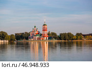 The Golden Ring of Russia, the city of Pereslavl-Zalessky. The Church of the Forty Sevastian Martyrs is reflected at sunset in Pleshcheyev Lake. Стоковое фото, фотограф Photojuli / Фотобанк Лори