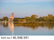 The Golden Ring of Russia, the city of Pereslavl-Zalessky. The Church of the Forty Sevastian Martyrs is reflected at sunset in Pleshcheyev Lake. Стоковое фото, фотограф Photojuli / Фотобанк Лори