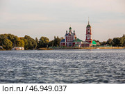 The Golden Ring of Russia, the city of Pereslavl-Zalessky. The Church of the Forty Sevastian Martyrs is reflected at sunset in Pleshcheyev Lake. Стоковое фото, фотограф Photojuli / Фотобанк Лори