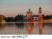 The Golden Ring of Russia, the city of Pereslavl-Zalessky. The Church of the Forty Martyrs of Sebaste at a beautiful pink sunset on the side of Lake Pleshcheyev. Стоковое фото, фотограф Photojuli / Фотобанк Лори