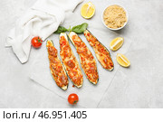 Лодочки из кабачков, фаршированные мясом, на светлом фоне. Стоковое фото, фотограф Pixel_shot / Фотобанк Лори