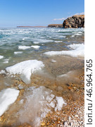 Baikal Lake in spring sunny day. Beautiful landscape with white ice floes melting on coast of Olkhon Island on shallow bay. Ice drift in Small Sea. Natural background. Change of seasons. Spring travels. Стоковое фото, фотограф Виктория Катьянова / Фотобанк Лори