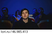 Spectator illuminated by spotlight at theatrical performance. Стоковое фото, фотограф David Kashakhi / Фотобанк Лори