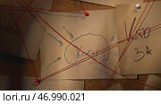 Mysterious word in rebus from notes on board with red thread. Стоковое фото, фотограф David Kashakhi / Фотобанк Лори