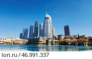 Dubai - United Arab Emirates, January 23, 2023: Panoramic view of Downtown Dubai with Address Downtown Hotel. Редакционное фото, фотограф David Kashakhi / Фотобанк Лори