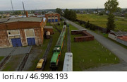 Aerial view of old trams parking on railways station with rust. Стоковое фото, фотограф David Kashakhi / Фотобанк Лори