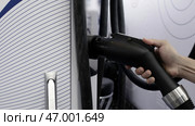 Detailed Close-Up View of Charging Equipment Designed for Electric Vehicles and EVs. Стоковое фото, фотограф David Kashakhi / Фотобанк Лори