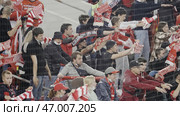 Serbia - Belgrade, august 23, 2022: Fans gather in a stadium to cheer for their favorite sports team on a sunny day. Редакционное фото, фотограф David Kashakhi / Фотобанк Лори