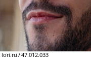 A young man with stubble who was shot from a close angle. Стоковое фото, фотограф David Kashakhi / Фотобанк Лори