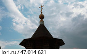 Christian orthodox church building with cross on roof top under cloudy sky low angle shot. Стоковое фото, фотограф David Kashakhi / Фотобанк Лори
