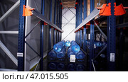 Shelves of pure bottled water inside a storage warehouse. Стоковое фото, фотограф David Kashakhi / Фотобанк Лори