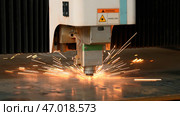 Metalworking Exhibition and a laser cutting machine working with sheet metal. Стоковое фото, фотограф David Kashakhi / Фотобанк Лори