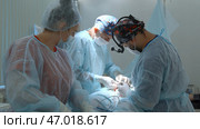 Close up of surgery performed by professional specialists. Стоковое фото, фотограф David Kashakhi / Фотобанк Лори