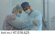Close up of surgery performed by professional specialists. Стоковое фото, фотограф David Kashakhi / Фотобанк Лори