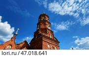 Time lapse accelerated movement of clouds in the blue sky over the Christian Church. Стоковое фото, фотограф David Kashakhi / Фотобанк Лори