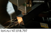 Machine for laser cutting of metal makes the cutting of a metal detail. Стоковое фото, фотограф David Kashakhi / Фотобанк Лори
