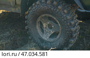 Close-up of a large SUV tire with a deep tread pattern. Tires for heavy off-roading. Стоковое фото, фотограф Воловодов Владимир / Фотобанк Лори