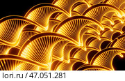 Close up of abstract plastic golden springs stretching isolated on a black background. Стоковая иллюстрация, иллюстратор David Kashakhi / Фотобанк Лори