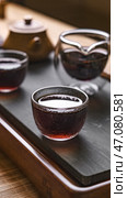 An Elegant and Serene Tea Ceremony Alive with Traditional Teaware and Calming Rituals. Стоковое фото, фотограф David Kashakhi / Фотобанк Лори