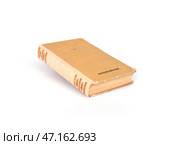 Old book in brown cover isolated on a white background. Стоковое фото, фотограф Елена  Попкова / Фотобанк Лори