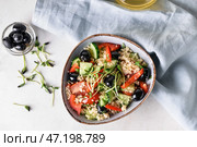 Чаша с кускусом и овощами на светлом фоне. Стоковое фото, фотограф Pixel_shot / Фотобанк Лори