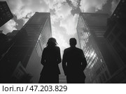 A stylish and atmospheric black and white image of an urban environment, filled with symbolism. The frame shows silhouettes of two people (a man and a woman) in business clothes, standing with their backs to the viewer and looking up at massive skyscrapers reaching into the sky. High-rise buildings framing the sky create a sense of power and forward momentum. The contrast between light clouds and dark buildings emphasizes the grandeur of the architecture and creates a dramatic mood. The composition inspires thoughts about the future, ambitions and fortitude. Стоковое AI-изображение, AI-художник Анна Кривицкая / Фотобанк Лори
